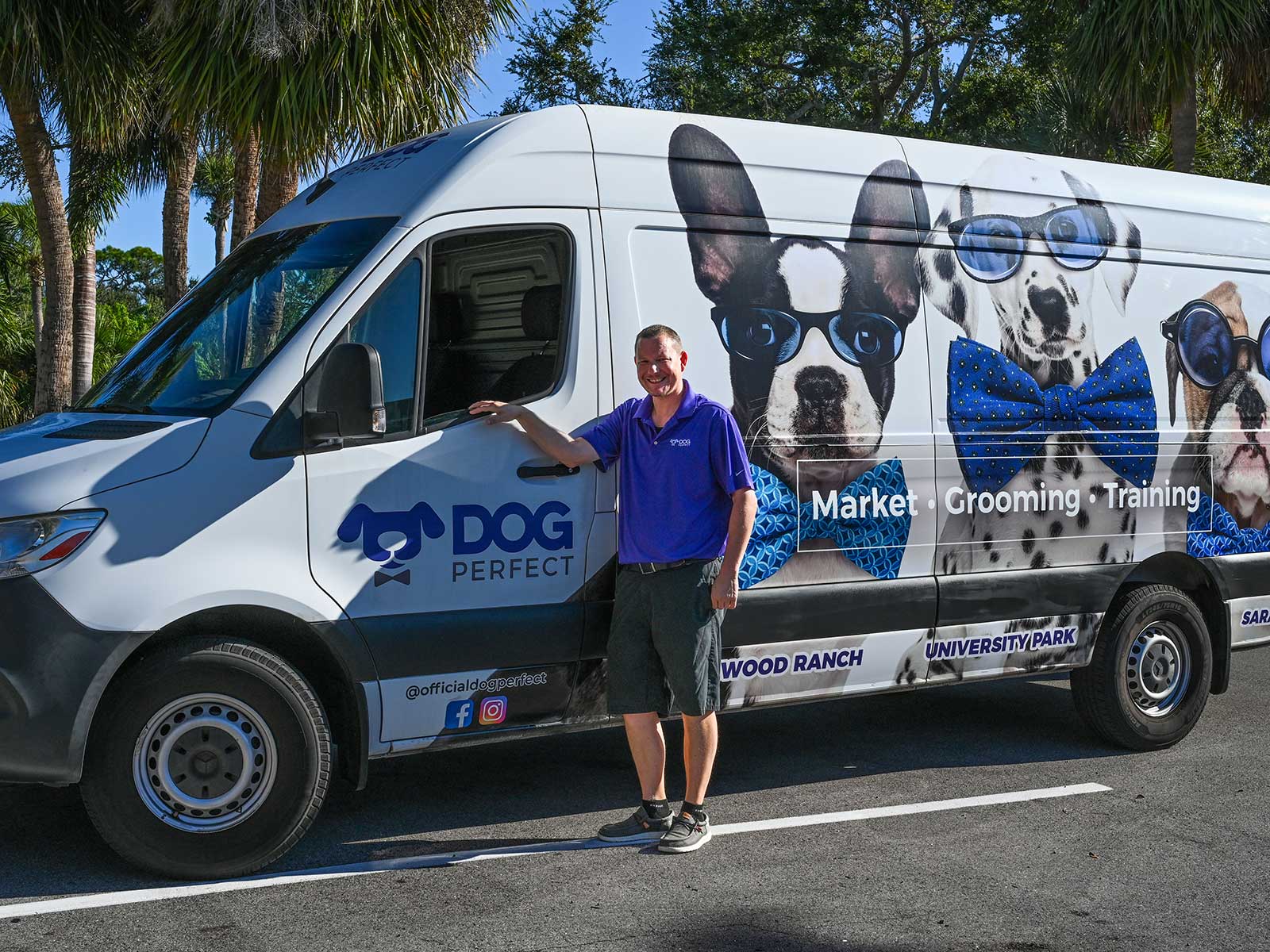 DOGPerfect team member delivering pet supplies to a customer and their dog